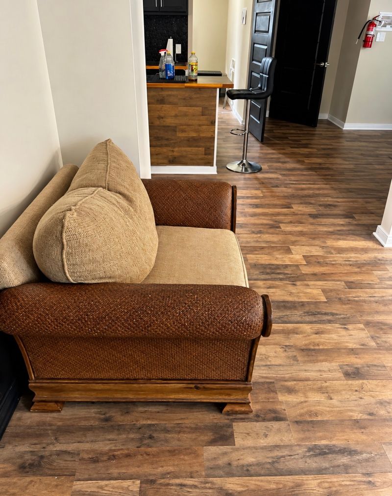 Sitting area with a loveseat, looking toward the kitchen
